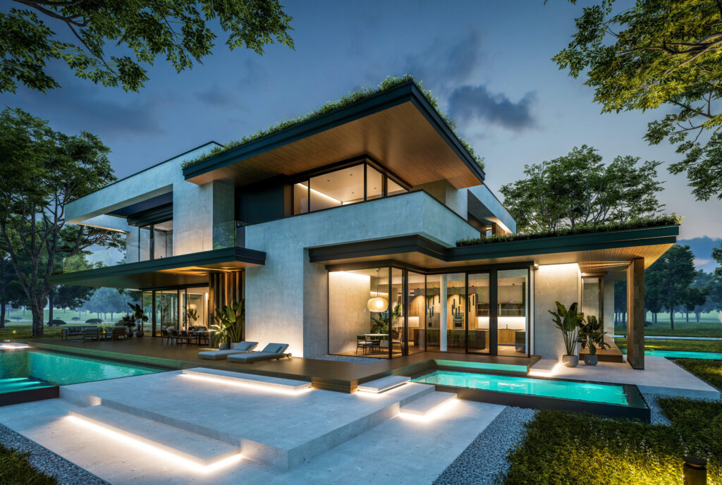 Moderne Luxusvilla mit Flachdach, Pool und beleuchteter Terrasse in der Abenddämmerung.